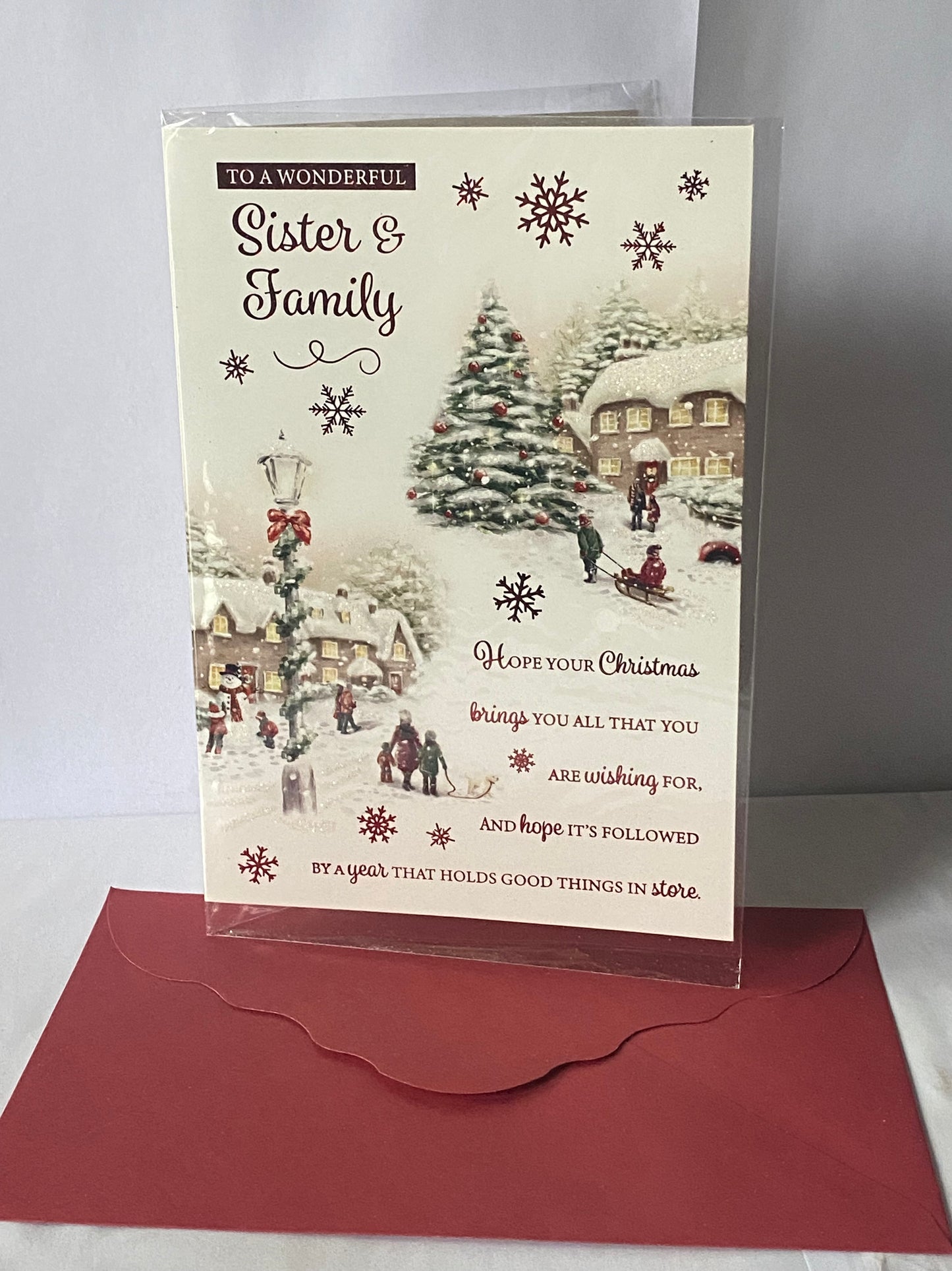 To A Wonderful Sister & Family Christmas Card Houses/People/Red Words(PH46334A)