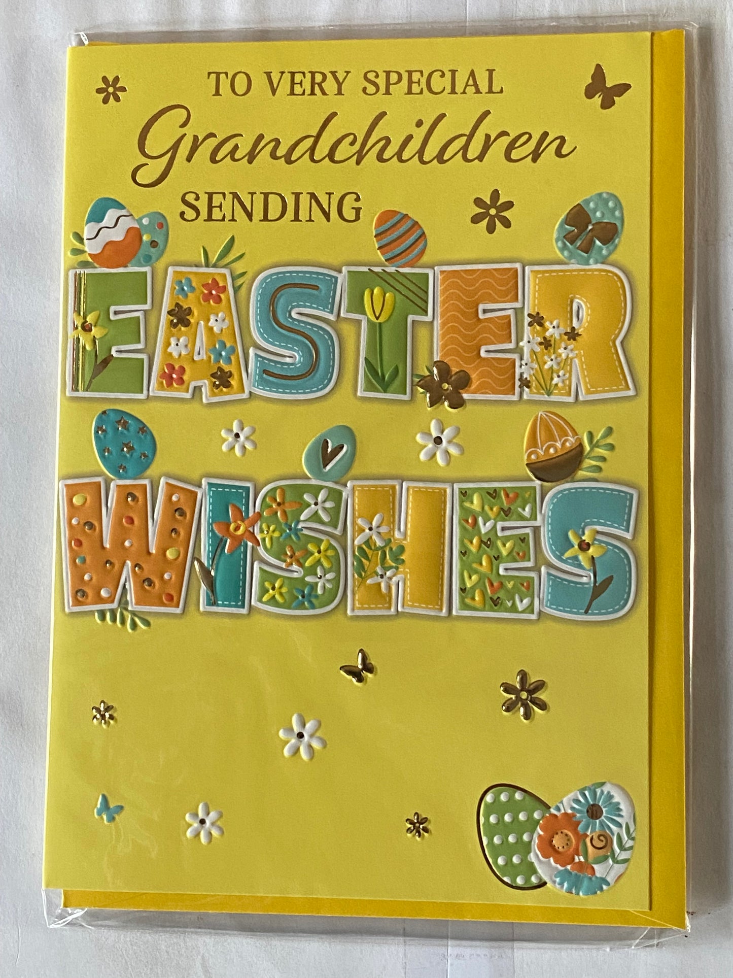 To Very Special Grandchildren Sending Easter Wishes Easter Card Yellow-Blue/Green/Yellow/Orange Words/Easter Eggs Foil Detail (PH49855E)