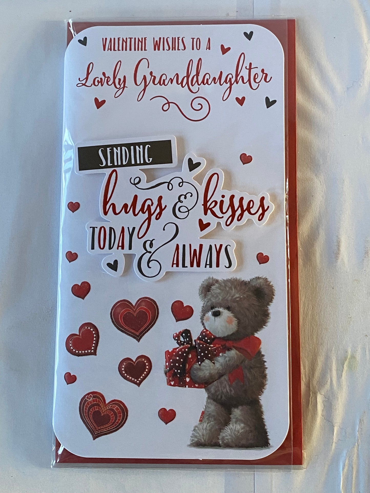 Valentine Wishes To A Lovely Granddaughter Sending Hugs & Kisses Today & Always Valentine's Day Valentines Day Card Teddy Holding Red Present/Hearts/Words 3D/Foil Detail(PRELUDE45313)