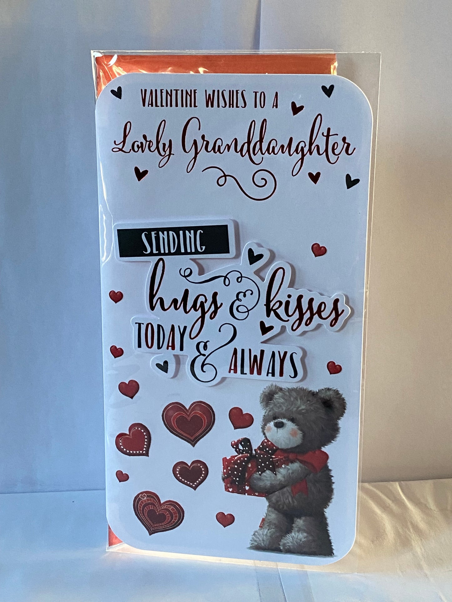 Valentine Wishes To A Lovely Granddaughter Sending Hugs & Kisses Today & Always Valentine's Day Valentines Day Card Teddy Holding Red Present/Hearts/Words 3D/Foil Detail(PRELUDE45313)