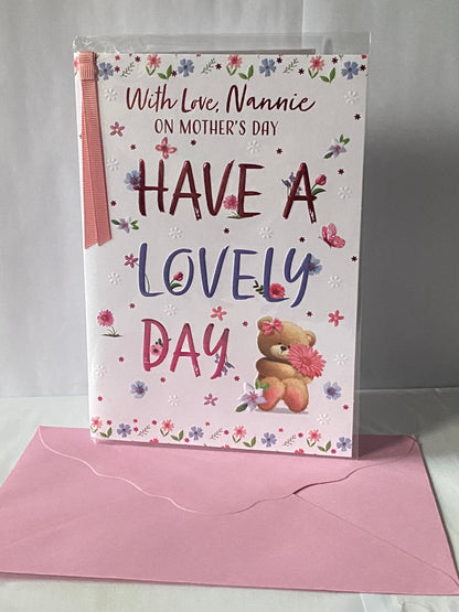 With Love Nannie On Mother's Day Have A Lovely Day Mother's Day Mothers Day Card Sitting Teddy Holding Pink Flower/Words Ribbon/Foil Detail(PRELUDE49793)