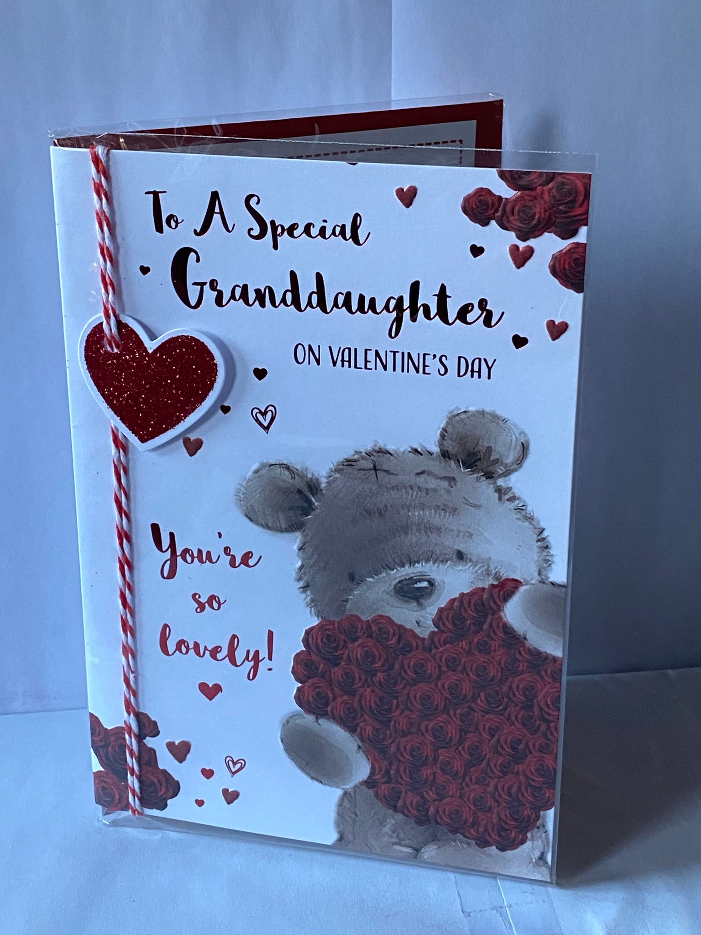 To A Special Granddaughter On Valentine's Day You're So Lovely! Valentines Day Card Teddy Holding Big Red Rose Heart String/Glitter/3D/Foil Detail(PRELUDE45309)