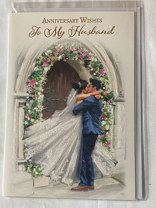 Anniversary Wishes To My Husband On Our Wedding Anniversary Card Bride+Groom Kissing/Floral Archway Glitter/Foil Detail(NC-VA218E)