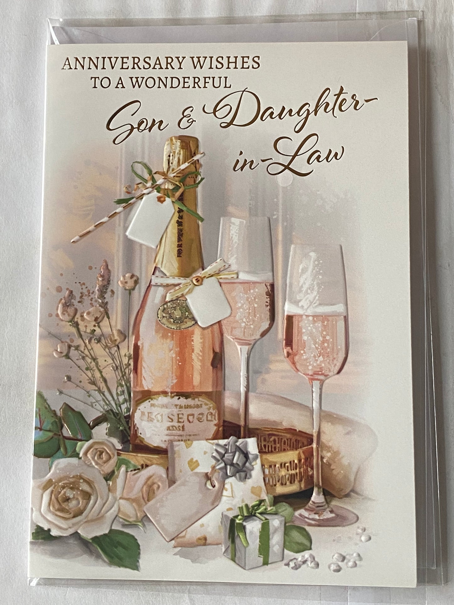 Anniversary Wishes To A Wonderful Son & And Daughter-In-Law On Your Wedding Anniversary Card Pink Champagne/Flutes/Roses Foil Detail(NC-VA287A)