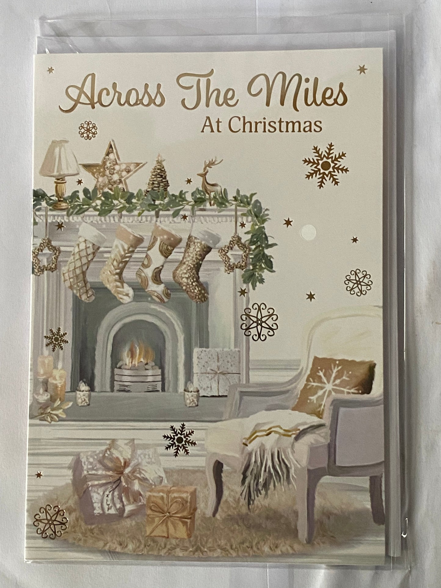 Across The Miles At Christmas Card White/Gold Stockings/Fireplace/Chair(PH50224A)