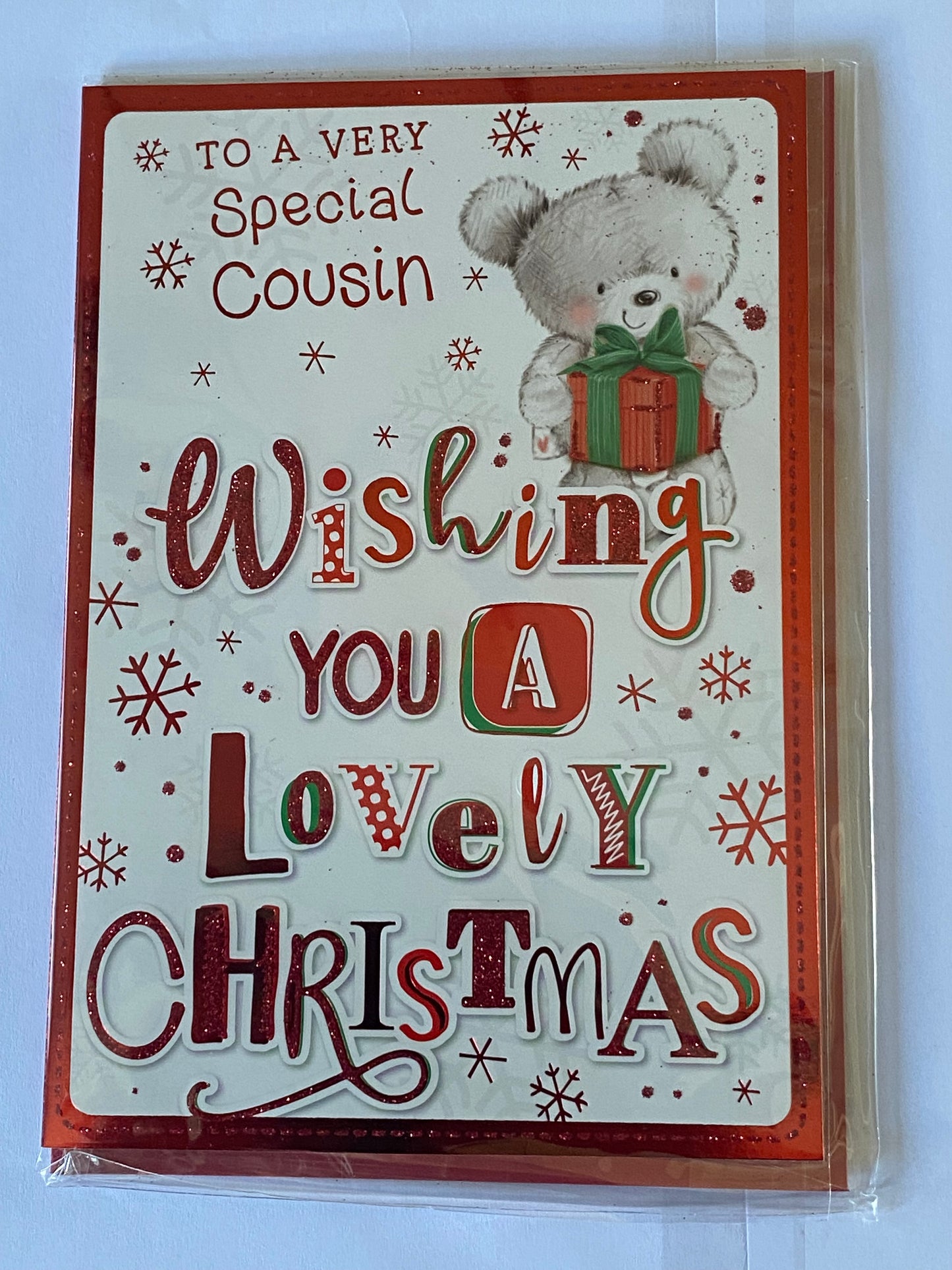 To A Very Special Cousin Wishing You A Lovely Christmas Card Teddy Carrying Red Present/Words Glitter/Foil Detail(PH45220A)