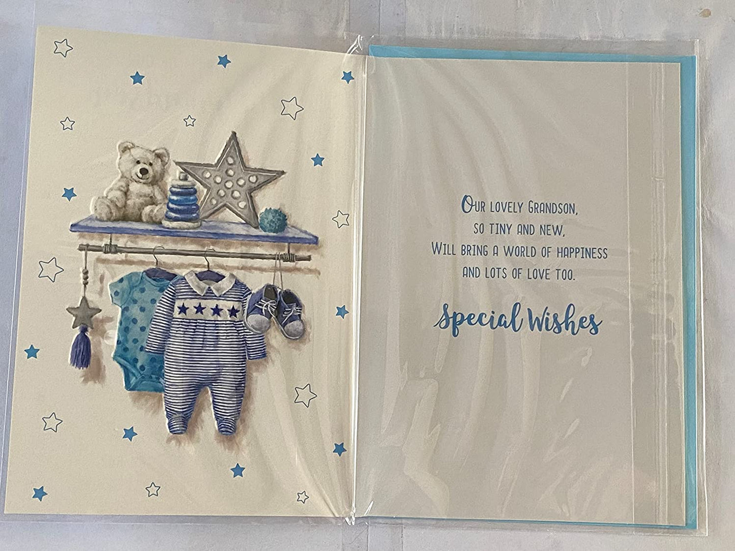 On The Birth of Our Lovely Grandson New Baby Boy Born Card from The Grandparents Blue Baby Clothes/Blue Star Foil Detail(NC-VA217A)